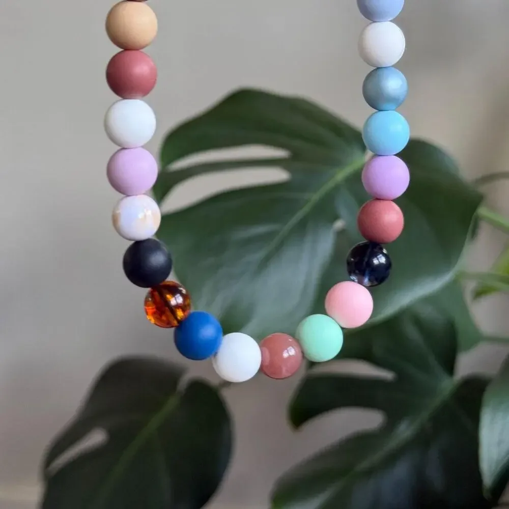 handmade lanyard with black leather cord and colorful round beads